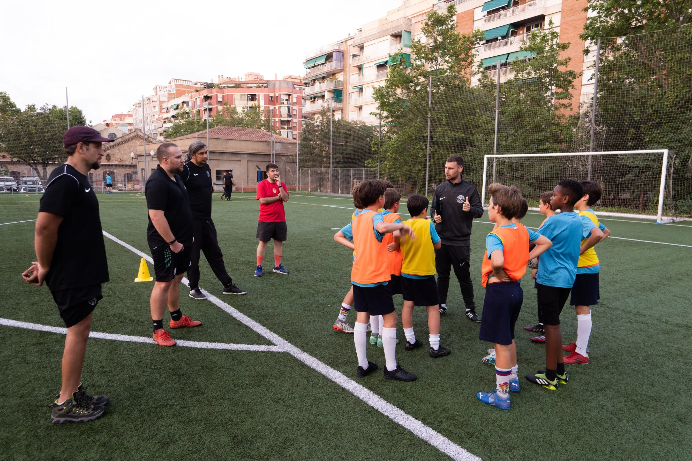 A Coaches' Voice School coach leading a youth training session