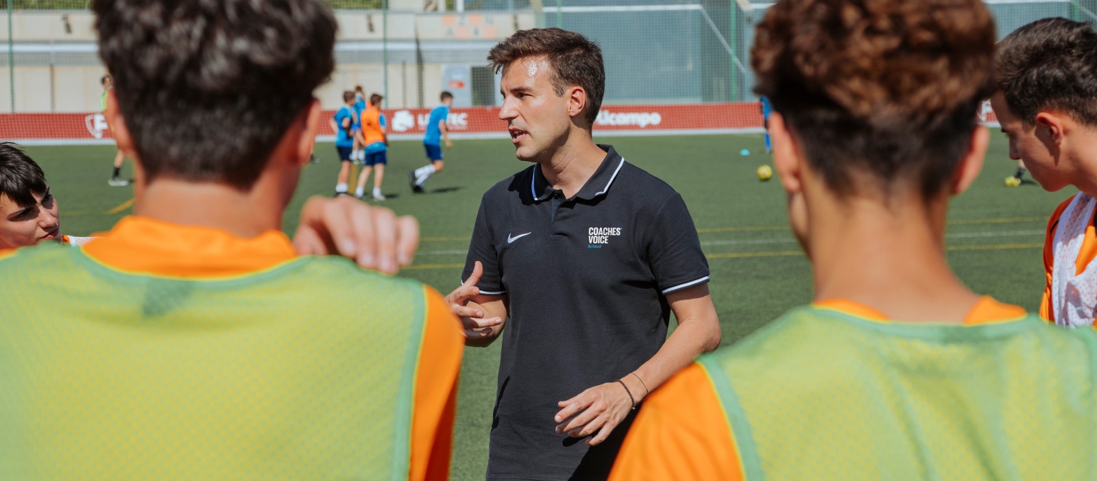 Coach briefing players in a training session